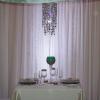 Stunning crystal curtains against white sheers for the sweetheart table