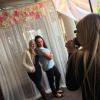 Flower valance and sheer drapes make for a romantic photobooth