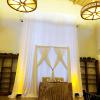 18 foot high poly drape with eye-catching 3D criss cross design focal point for this wedding ceremony and sweetheart table backdrop at Eagle Rock Center for the Arts.