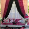 Fuchsia, blush, black, & white Pipe and Drape with Crystal Chandelier
